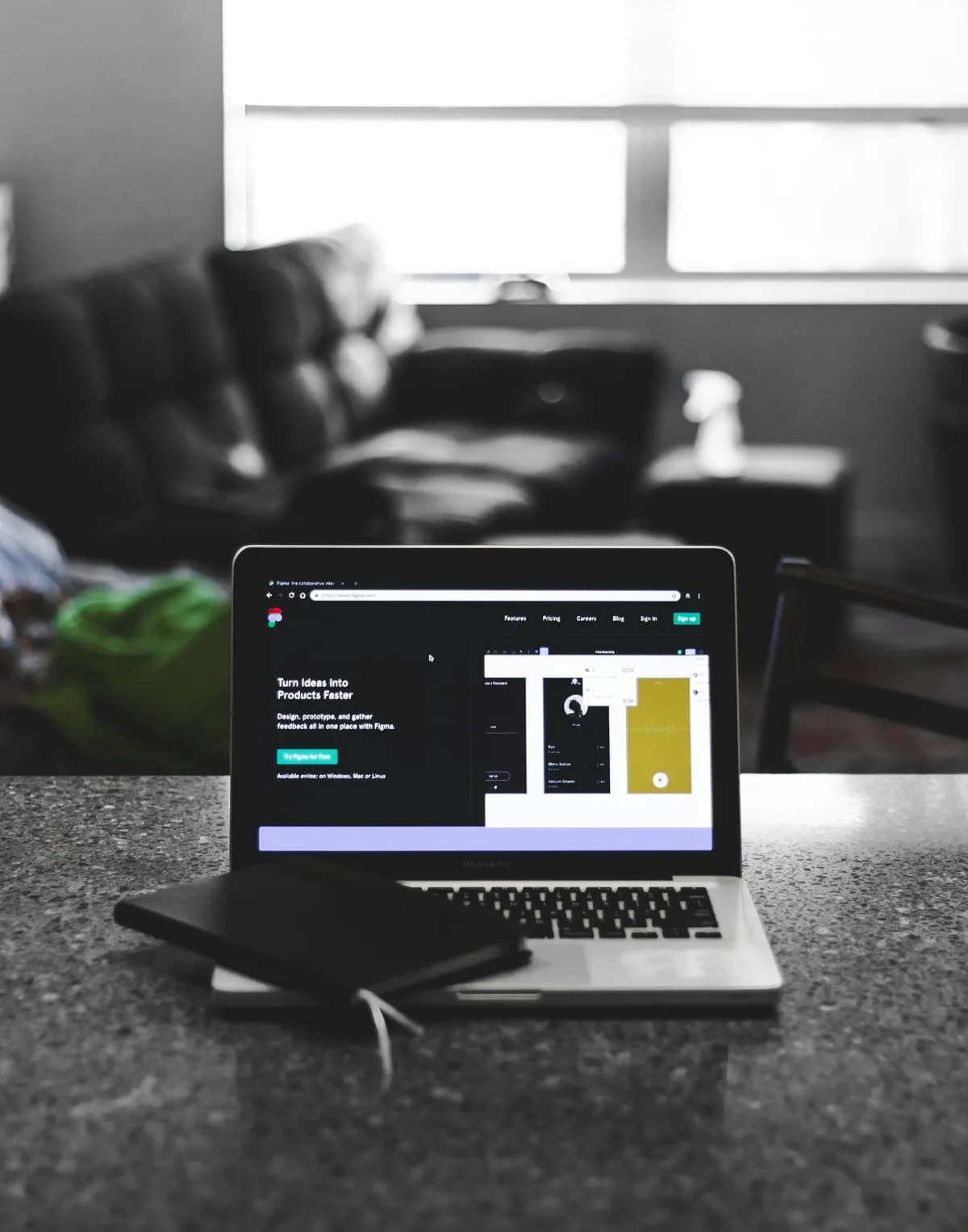 Laptop and external monitor on a desk showing code editor