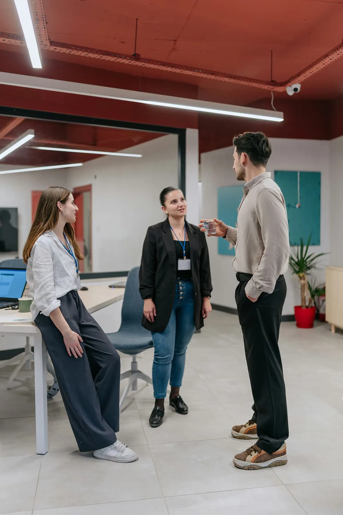 Group of professionals discussing work in an open office space